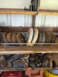 Tires on top shelf, lawnmower tires