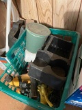 Milk crate with various lawn sprinklers