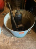 Metal bucket with a bottle jack