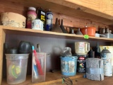 Funnels, paint, lighter fluid and other items on shelf