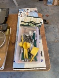 Silverware, measuring cups, mini tool bag and a paint stick