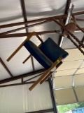 Wooden chair with blue vinyl cushion