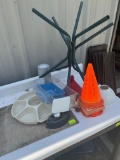 Orange cones, funnel, tupperware veggie tray, and other misc items