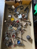 Nuts, bolts, screws, keys, wrench, and other hardware items