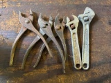 2 crescentwrenches and 3 pliers