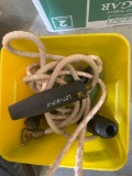 Yellow bucket with rope and misc items
