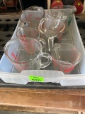 Several pyrex measuring cups