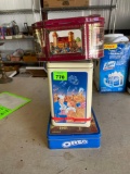 German inspired tin, cracker jack tin-and an Oreo Rin
