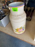 Ceramic flower pot with flowers on front