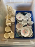 One plastic child's tea set and one ceramic child's tea set