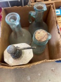 Two olive oil dispensers, glass dispenser with cork and lotion dispenser