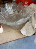 Glass decorative fruit bowl and a mug, crochet tablecloth