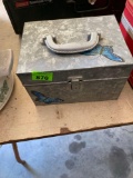 Metal box with butterflies on top