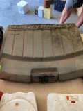 Action packer case with barbecue grill items and a vintage cutting board with mushroom pattern