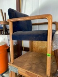Wood frame chair with blue seat cushions