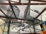 Two green metal outside chairs