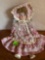 Porcelain doll in pink