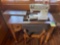 Singer sewing machine table 20x33x31 inches and chair. Table does need repair. Bring help to move