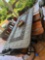 Outdoor metal table and set of 6 chairs with cushions. Item on table not included, bring help to
