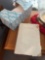 Bible, white basket, box of tissues, ashtray