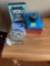 pencil box, glass container, posters, decor, and candle