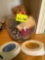 Glass bowl with popery, across, stuffed bear