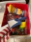 Box of misc items, hummingbird feeder, American flag, Velcro hanging strips, gorilla glue, raid bug