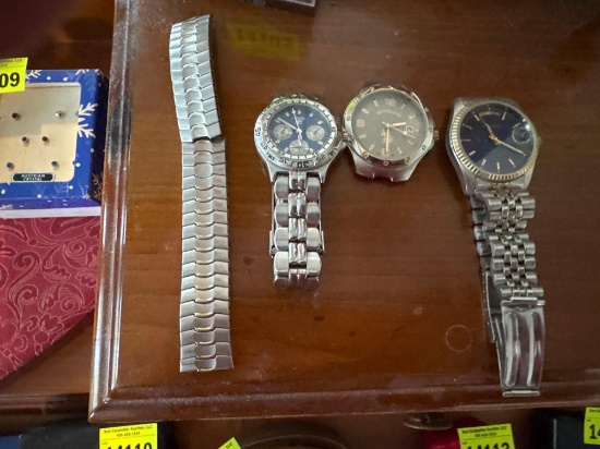Three watches and one watchband
