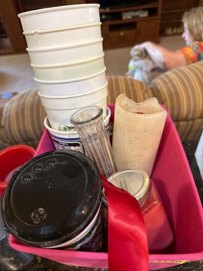 Plastic cups, candles, glass vase