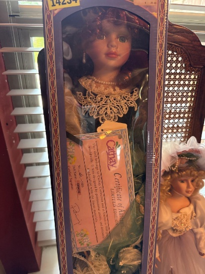 Two porcelain dolls, one in box