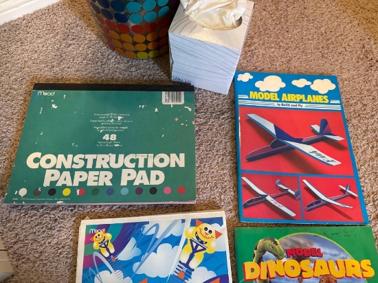 Waste basket, coloring books, construction paper, drawing tablet