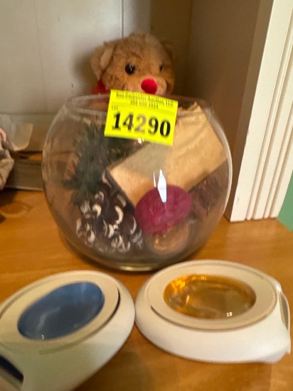 Glass bowl with popery, across, stuffed bear