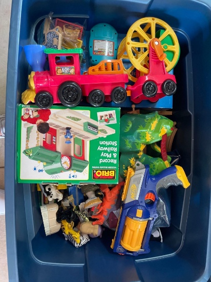 Tote full of toys, mostly train toys