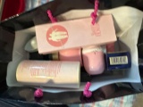Bag full of make up, Avon Body lotion, perfume, and makeup bags