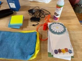Microfiber, cleaning cloths, more towels, glass case, notepads, sticky notes, power, cord, whistle,