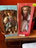 2 porcelain dolls in their box
