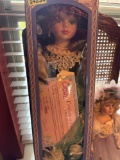 Two porcelain dolls, one in box