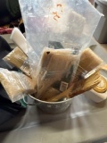 Paint brushes, towels, tape, small decorative metal bucket