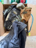 Army clothes, backpack, and jug water
