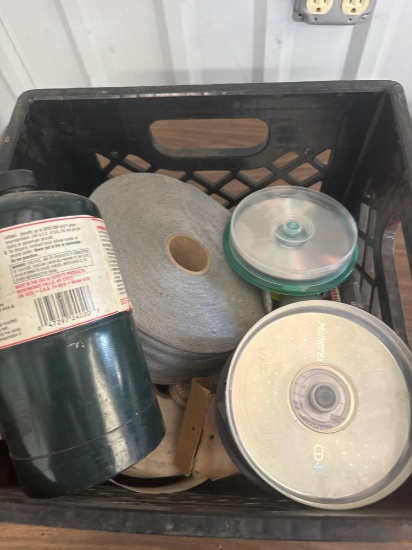 Fuel filter, sheet rock tape and other items in milk crate