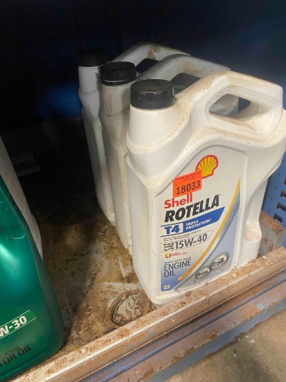 Rotella motor oil 2 appear unopened, one appears open