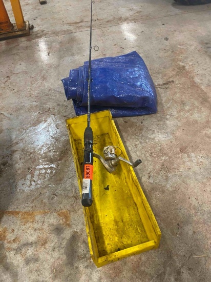 Tarp, fishing rod, yellow box