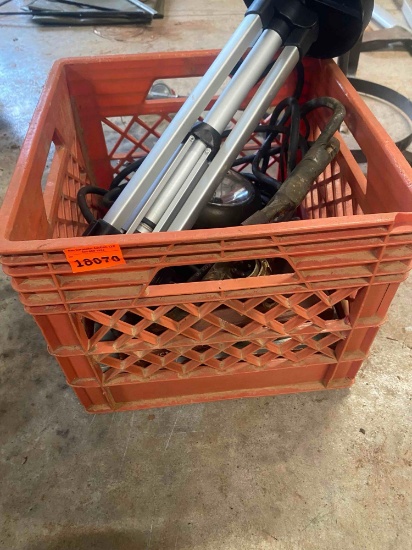 Milk crate with tripod, halogen light, cord, gun books