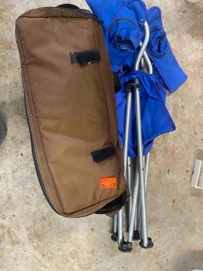 Folding chair and a brown bag