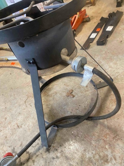 Outdoor propane burner stand and roll of green cloth