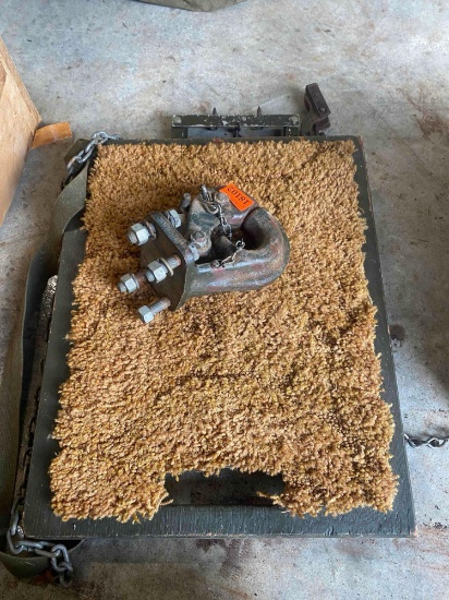 Military towing hook misc items with carpet on it
