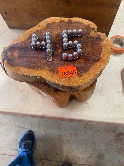 2 Pieces of wood one with 45 on it and one with JR in bullets