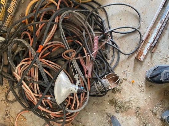Lot contains drop light, jumper cables, extension cords and other misc items