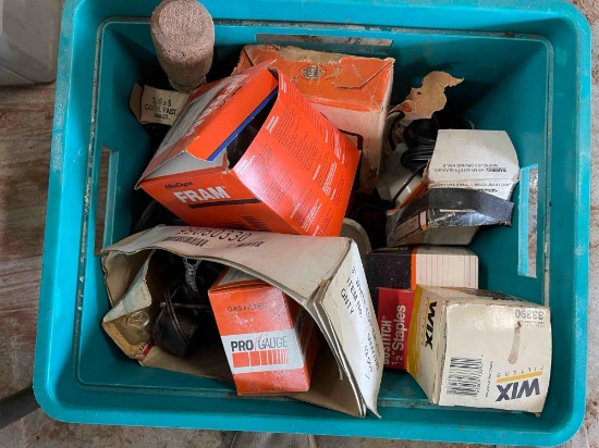 Tote with oil filters staples, PVC cap and more