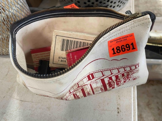 Money bag with staples and paper clips